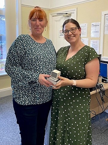 Photo of Jane Valentine receiving her long service gift from Alice Grant, Patient Services Manager