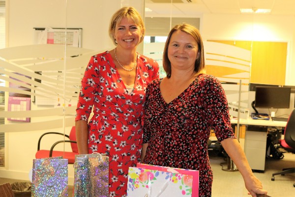 Tara (right) receiving her gifts from Finance Officer Rachael.